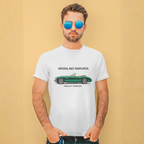 Man wearing a white t-shirt with a green classic car graphic and text against a beige background