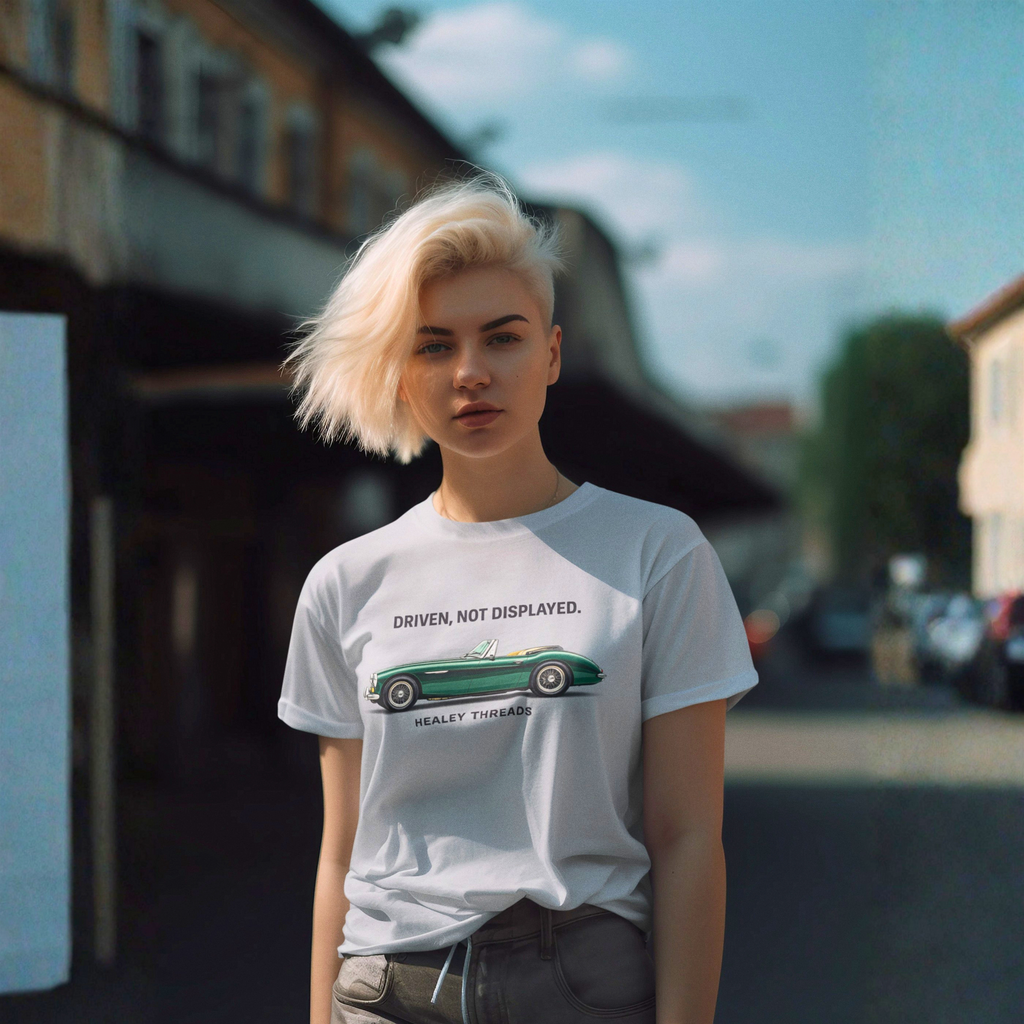 Girl wearing a gray t-shirt with a classic car graphic design on a city street