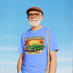 Man wearing a blue t-shirt with a graphic classic car design against a clear blue sky