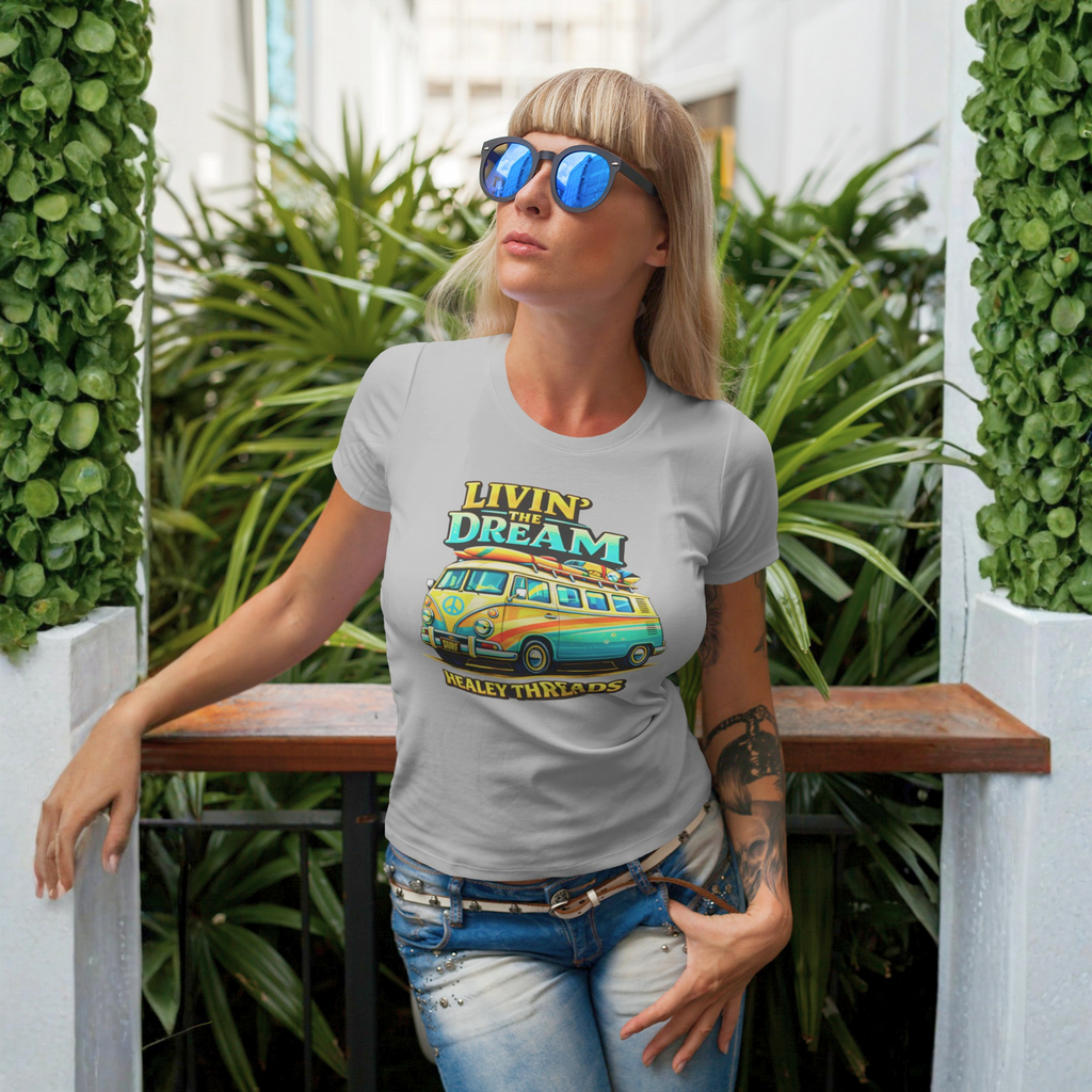 Woman wearing a gray t-shirt with a graphic van design outdoors