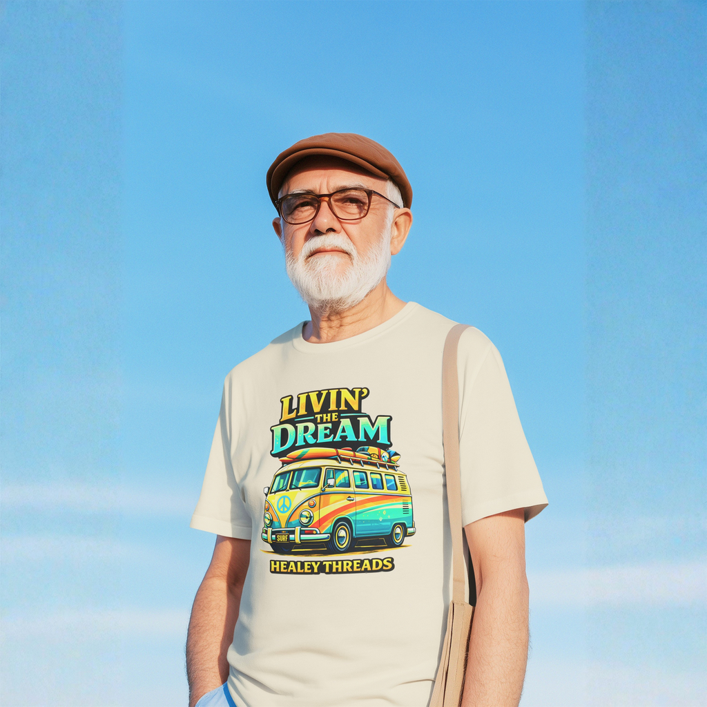 Man wearing a natural t-shirt with 'Livin' the Dream' van design against a blue sky.