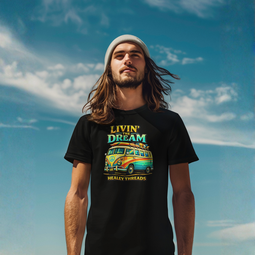 Man wearing a black t-shirt with a colorful van graphic and text against a blue sky.