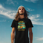 Man wearing a black t-shirt with a colorful van graphic and text against a blue sky.