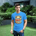 Man wearing a royal blue t-shirt with a graphic van design standing outdoors.