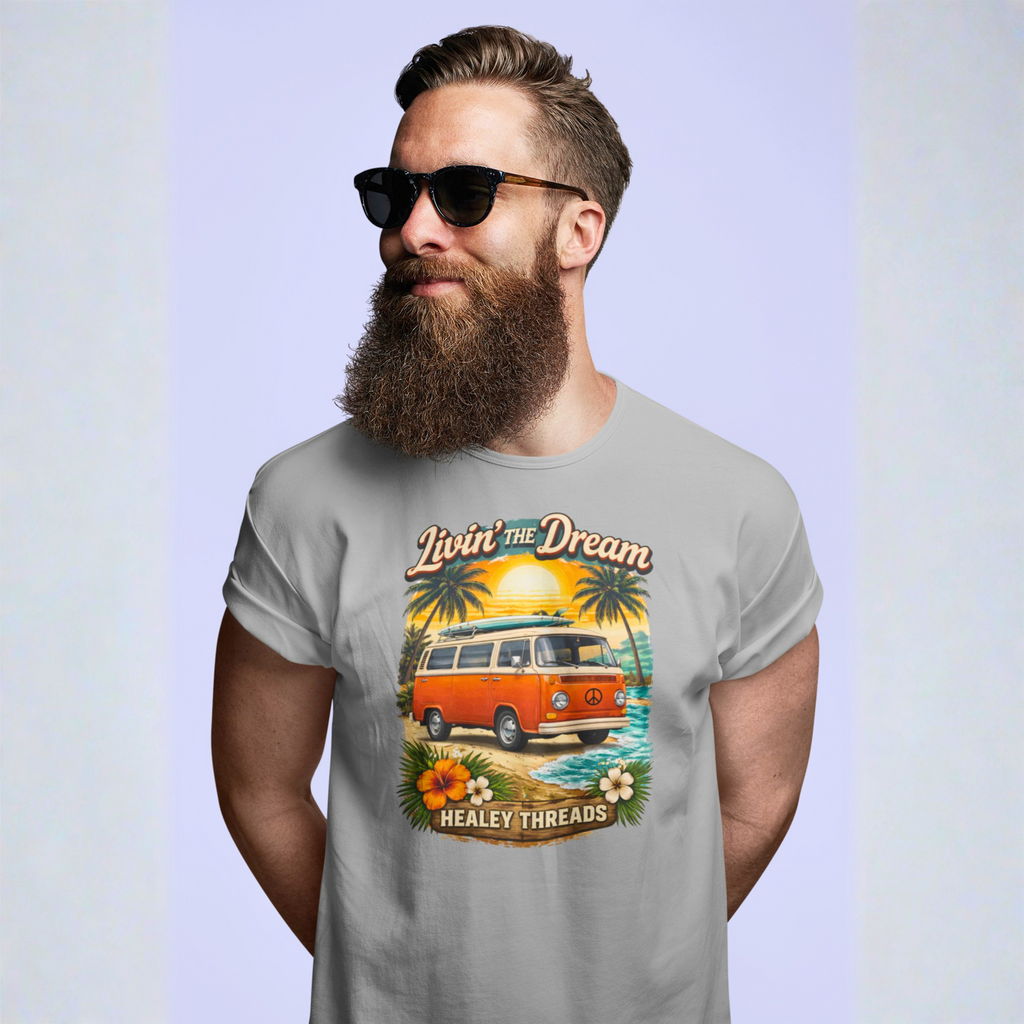 Man wearing a gray t-shirt with a graphic design of a van and beach scene, text 'Livin' The Dream' and 'Healy Threads'.