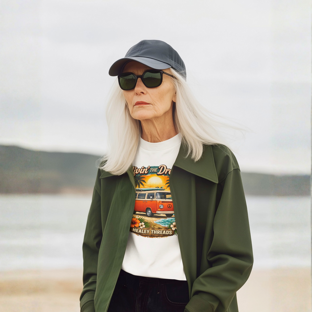 Woman wearing a graphic white t-shirt with a van design on a beach