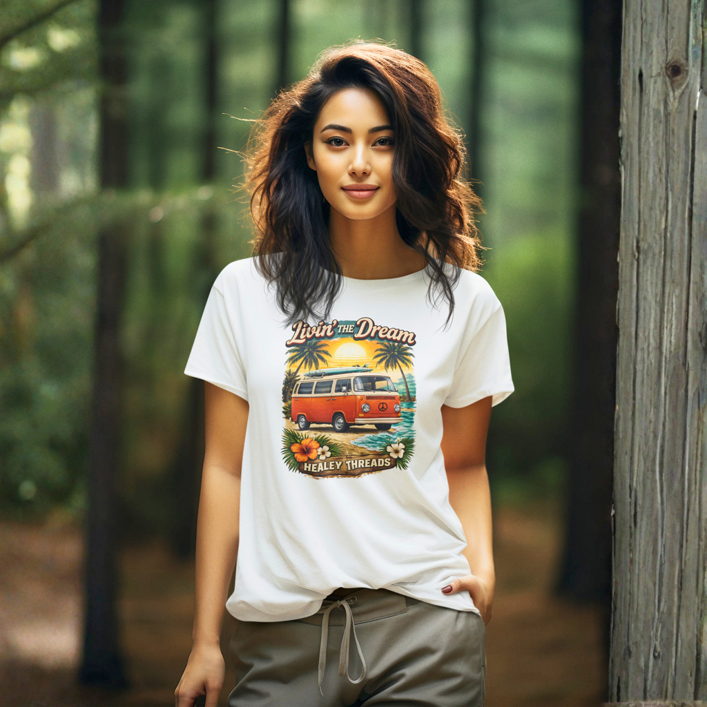 Woman wearing a white t-shirt with a graphic van design in a forest setting