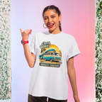 Woman wearing a white t-shirt with a graphic Mopar van design and text, standing against a gradient background.