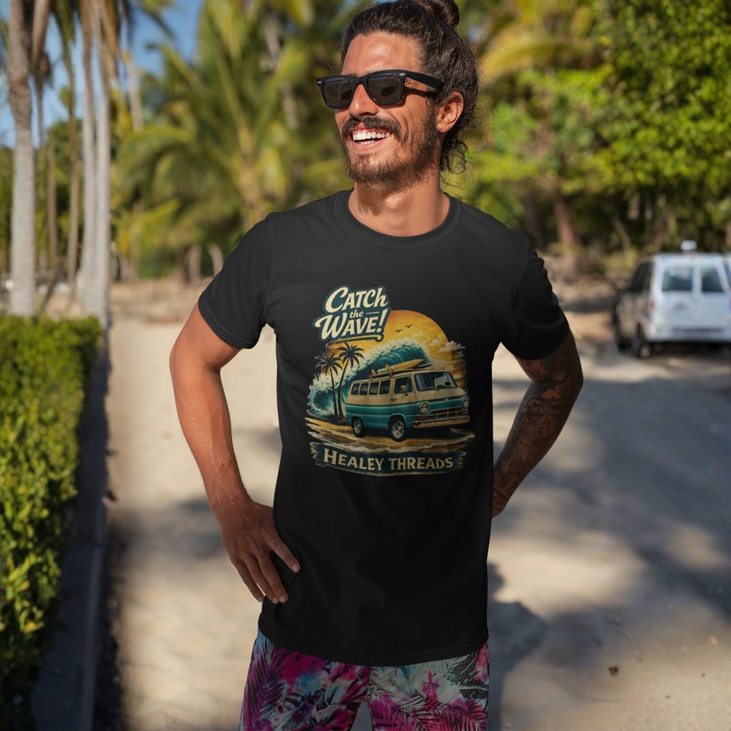 Man wearing a black t-shirt with a graphic Mopar van design and sunglasses, standing outdoors with palm trees in the background.