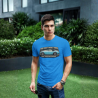 Man wearing a royal blue t-shirt with a graphic Healey design in an outdoor setting