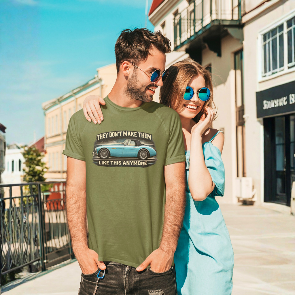 Man wearing a military green t-shirt with a graphic and text, standing next to a woman on a sunny street.