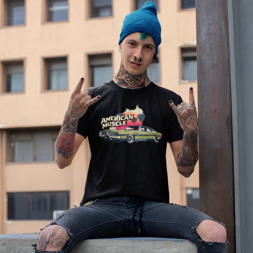 Man wearing a black t-shirt with 'American Muscle' graphic, sitting on a ledge with a building in the background.