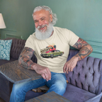 Man sitting on a couch wearing a t-shirt with 'American Muscle' graphic design.