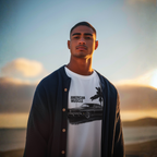 Man wearing a white t-shirt with 'American Muscle' graphic against a sunset background