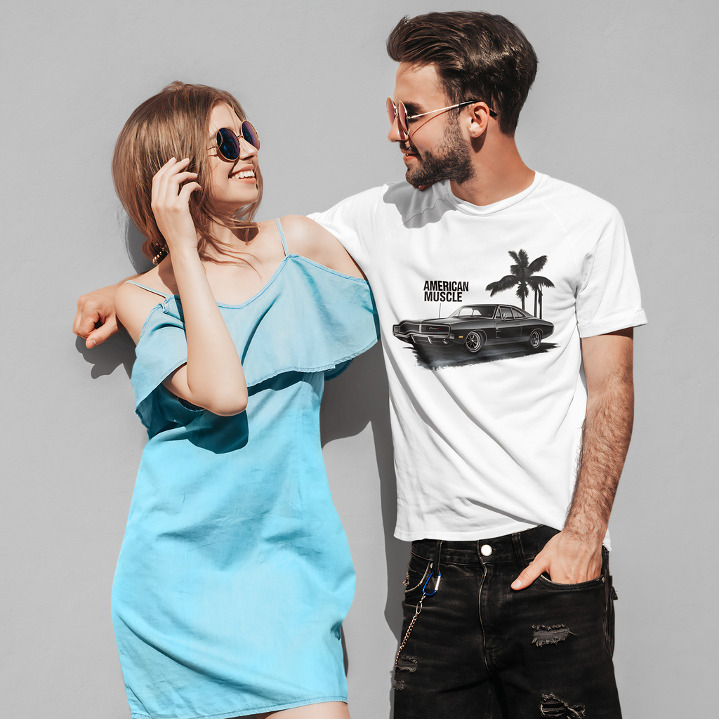Man and woman standing together, man wearing a white t-shirt with a graphic car design.