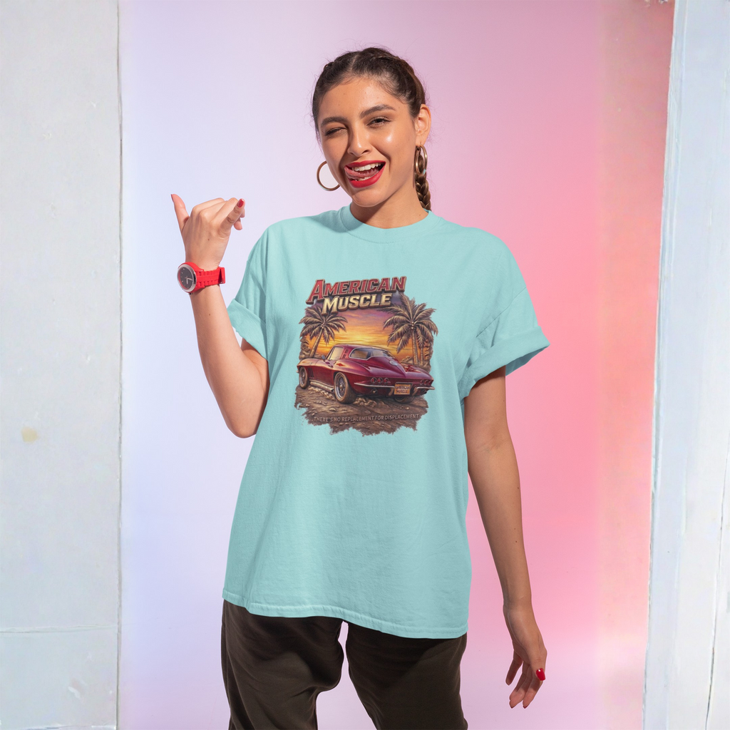 Woman wearing a light blue t-shirt with a graphic design, posing against a gradient background.