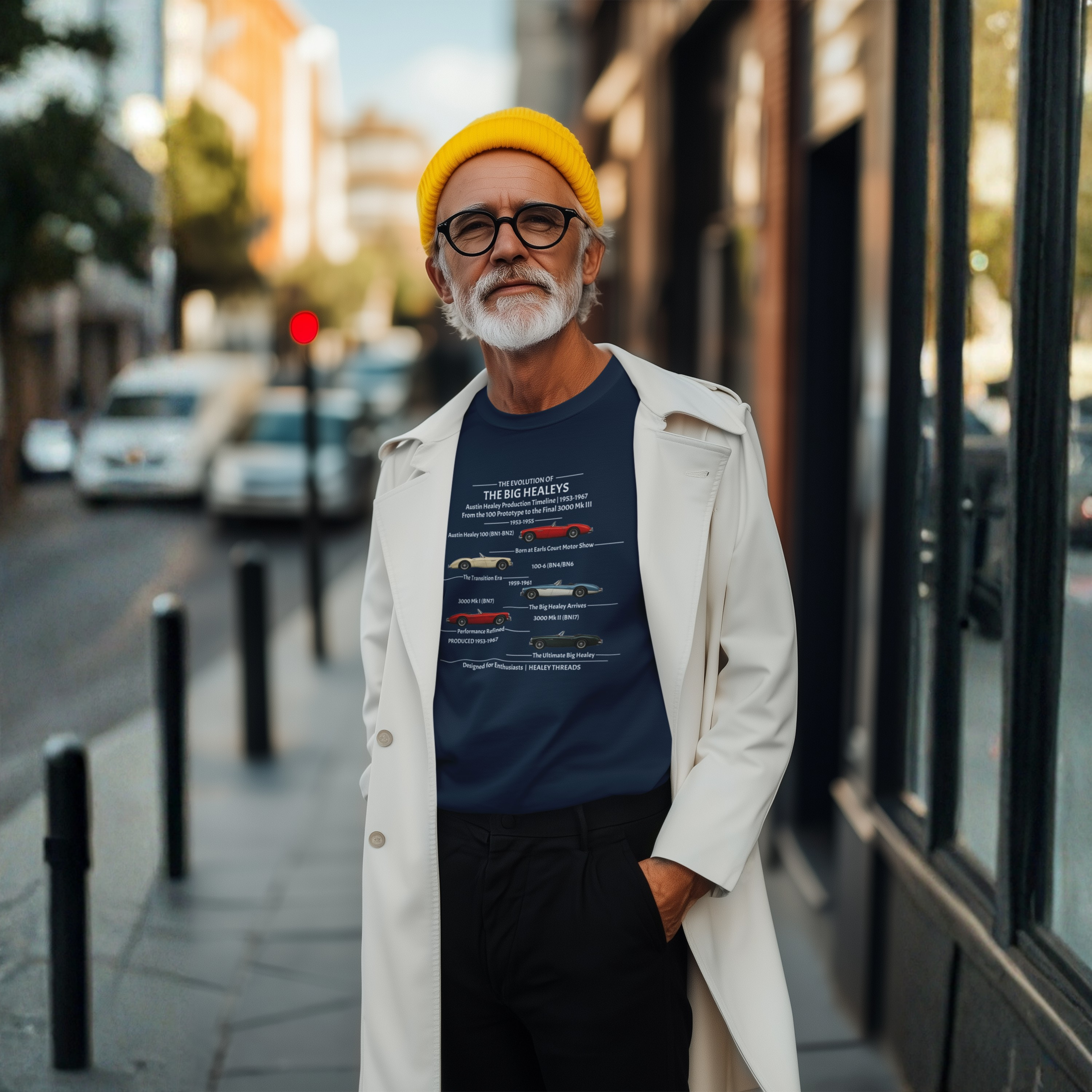 Man wearing a navy blue t-shirt with a Healey timeline graphic design on a street background