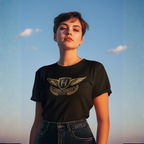 Woman wearing a black t-shirt with an Austin-Healey logo against a blue sky.