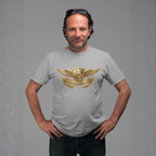 Man wearing a gray t-shirt with a gold Healey design on a gray background