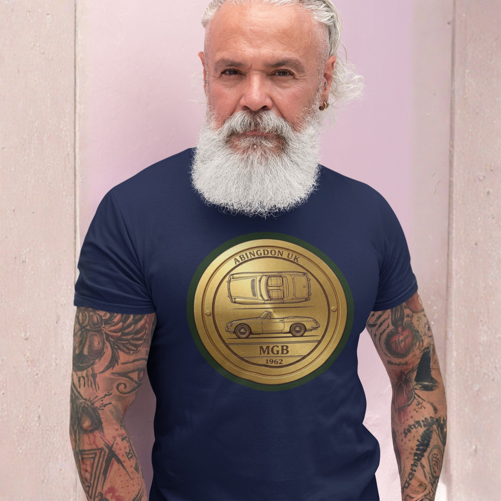 Man wearing a navy blue t-shirt with a gold emblem featuring a classic car design and text.