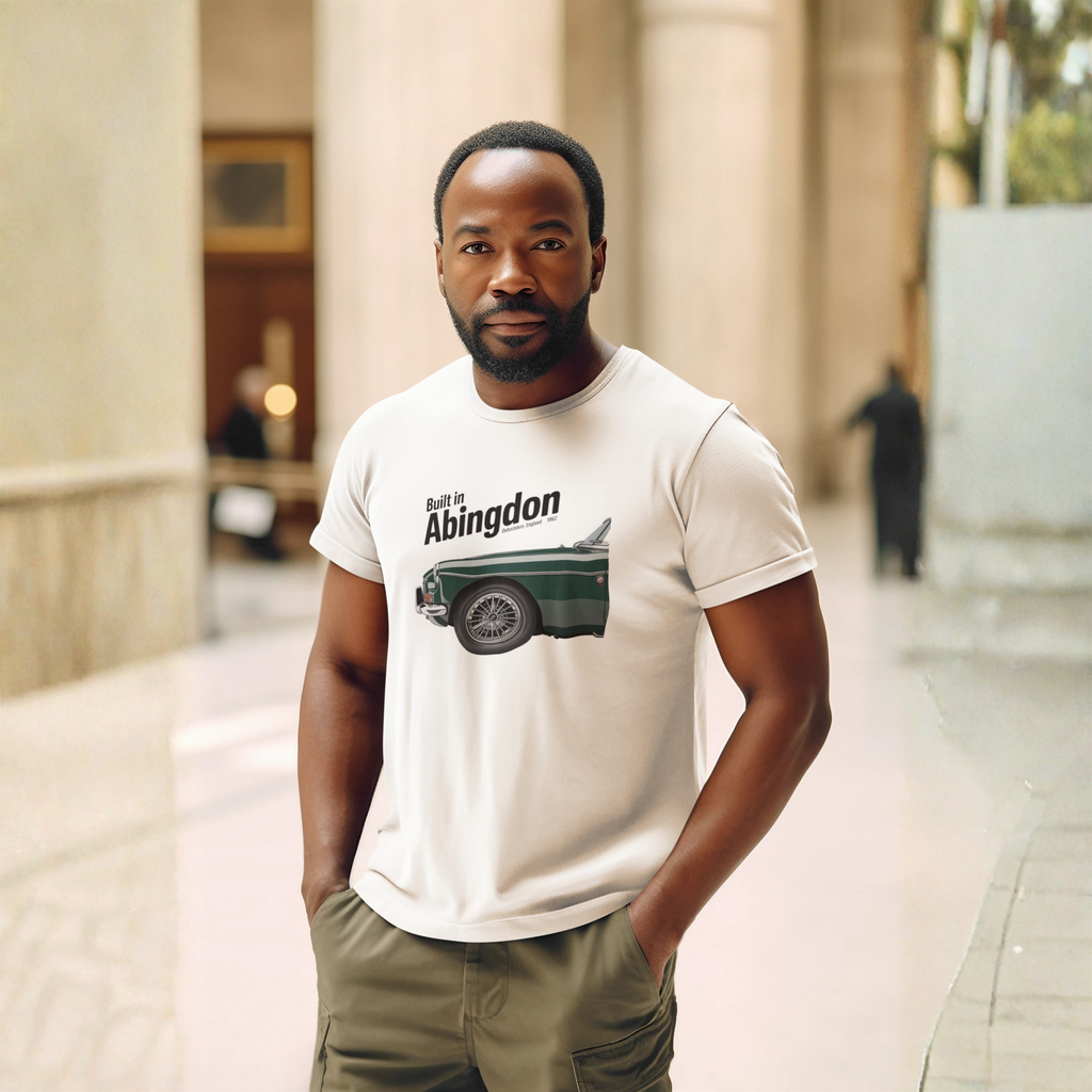 Man wearing a natural t-shirt with a classic car graphic design standing in an urban setting.