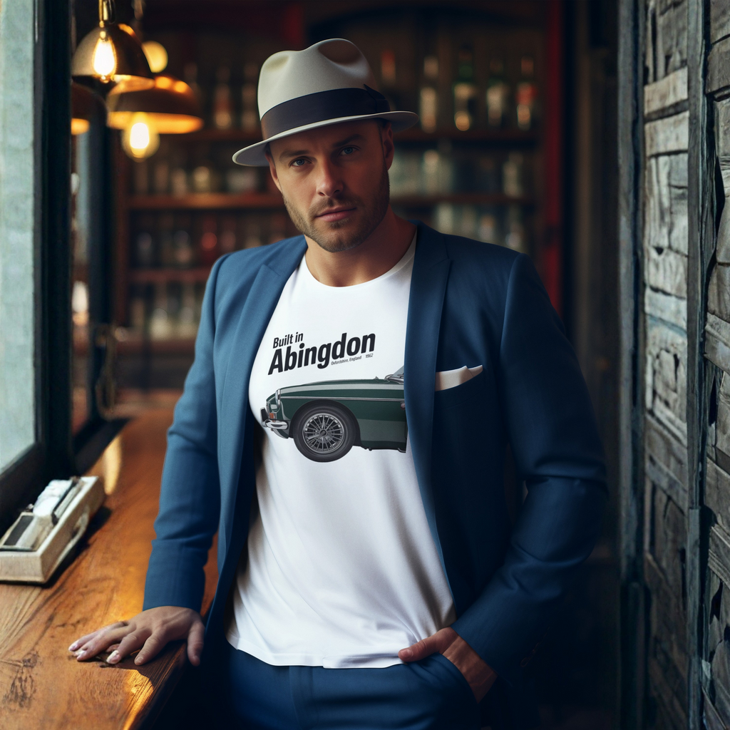 Man wearing a white t-shirt with a classic car graphic design and text, standing in a bar setting.