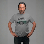 Man wearing a gray t-shirt with a classic car graphic design on a gray background