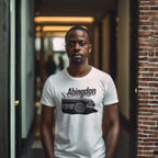 Man wearing a white t-shirt with 'Abingdon' design in a hallway.