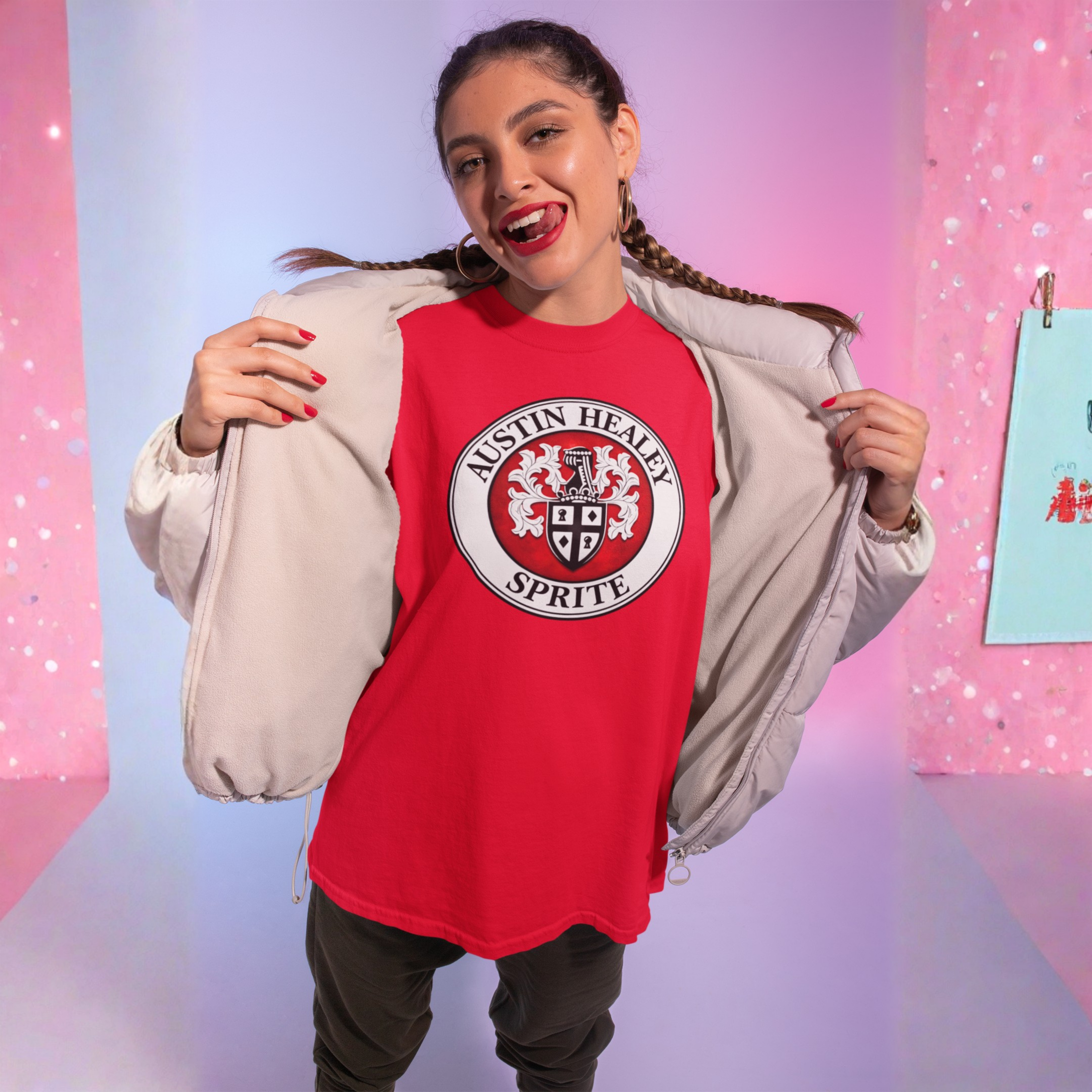 Girl wearing a red Austin Healey Sprite t-shirt with a beige jacket.