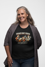 Woman wearing a black t-shirt with 'Track Day Crew' graphic design on a white background