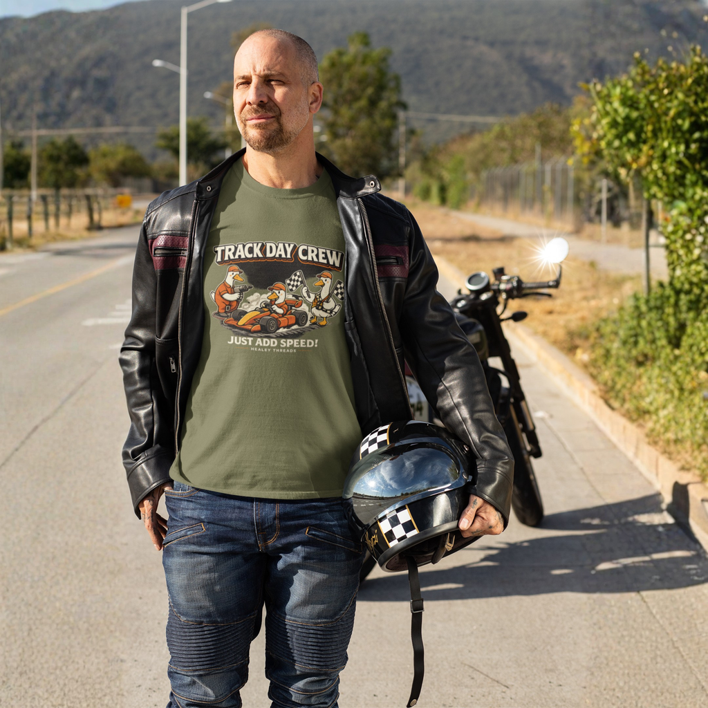 Man wearing a military green t-shirt with 'Track Day Crew' graphic on a motorcycle