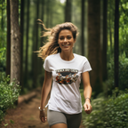 Woman running in a forest wearing a 'Track Day Crew' white t-shirt