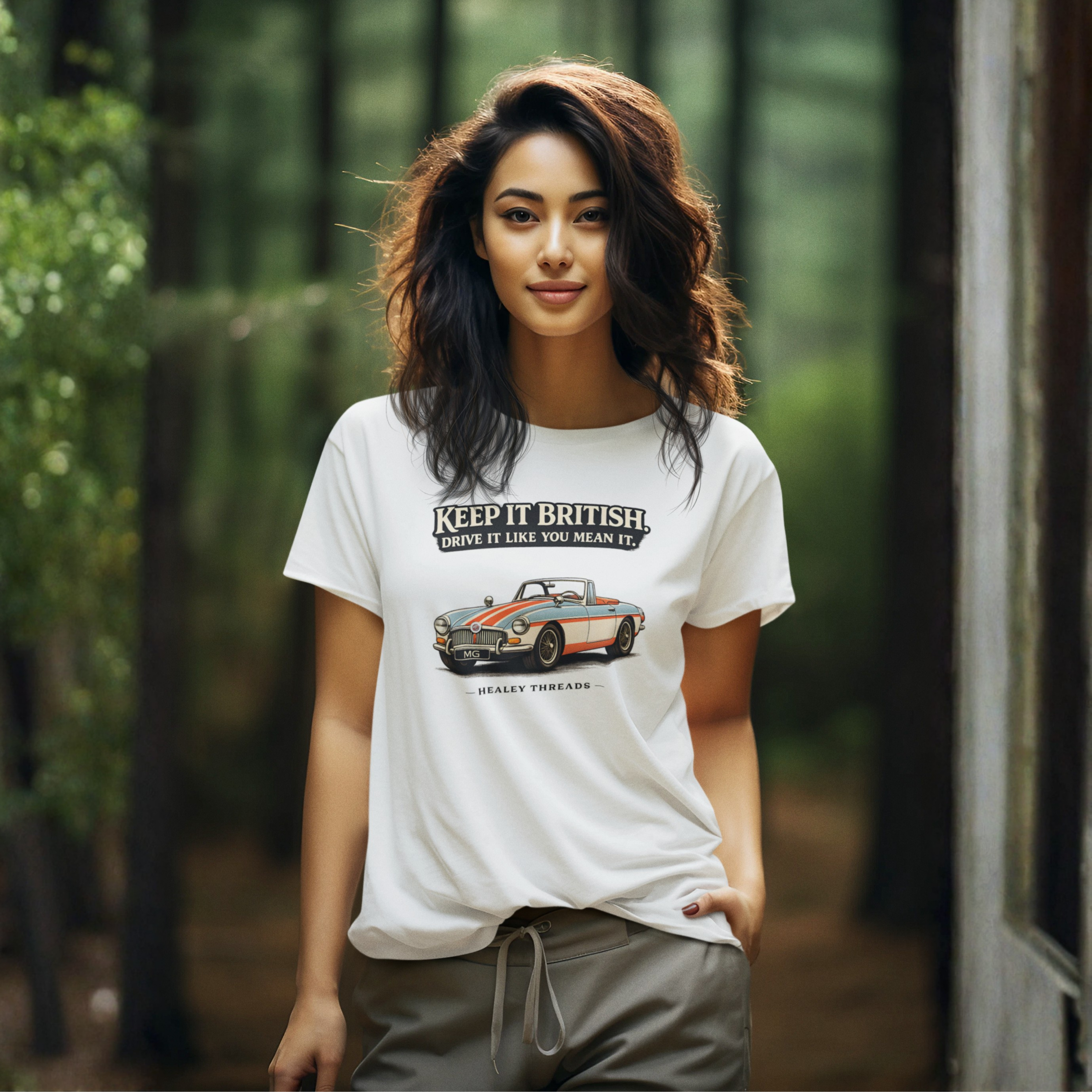 Woman wearing a white t-shirt with a MGB car graphic and text in a forest setting