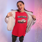 Girl wearing a red 'Keep It British' t-shirt with a MGB car graphic against a gradient background