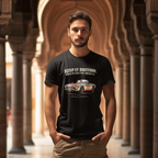 Man wearing a black t-shirt with a MGB car graphic and text in an architectural setting