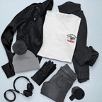 Healey t-shirt amongst a
collection of winter clothing and accessories on a light blue background