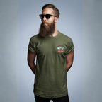 Man wearing a military green t-shirt with a Healey logo on left chest, on a gray background