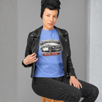 Woman wearing a Carolina blue t-shirt with an Austin-Healey logo and a black leather jacket.