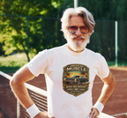Man wearing a white t-shirt with a classic car graphic design on a tennis court