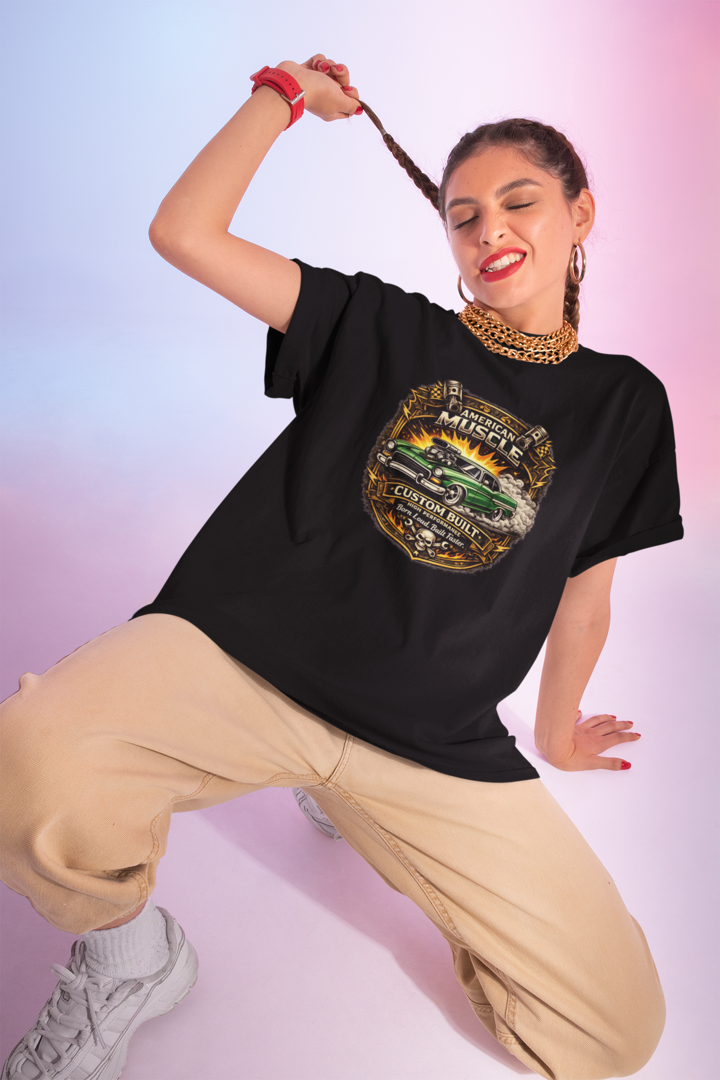 Woman wearing a black t-shirt with a graphic hot rod design on a gradient background