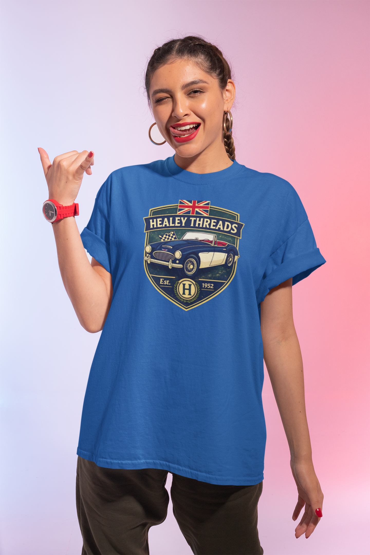 Woman wearing a royal blue t-shirt with 'Healey Threads' design on a gradient background