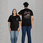 Two people wearing black t-shirts with a car design and 'Healey' branding on a gray background.