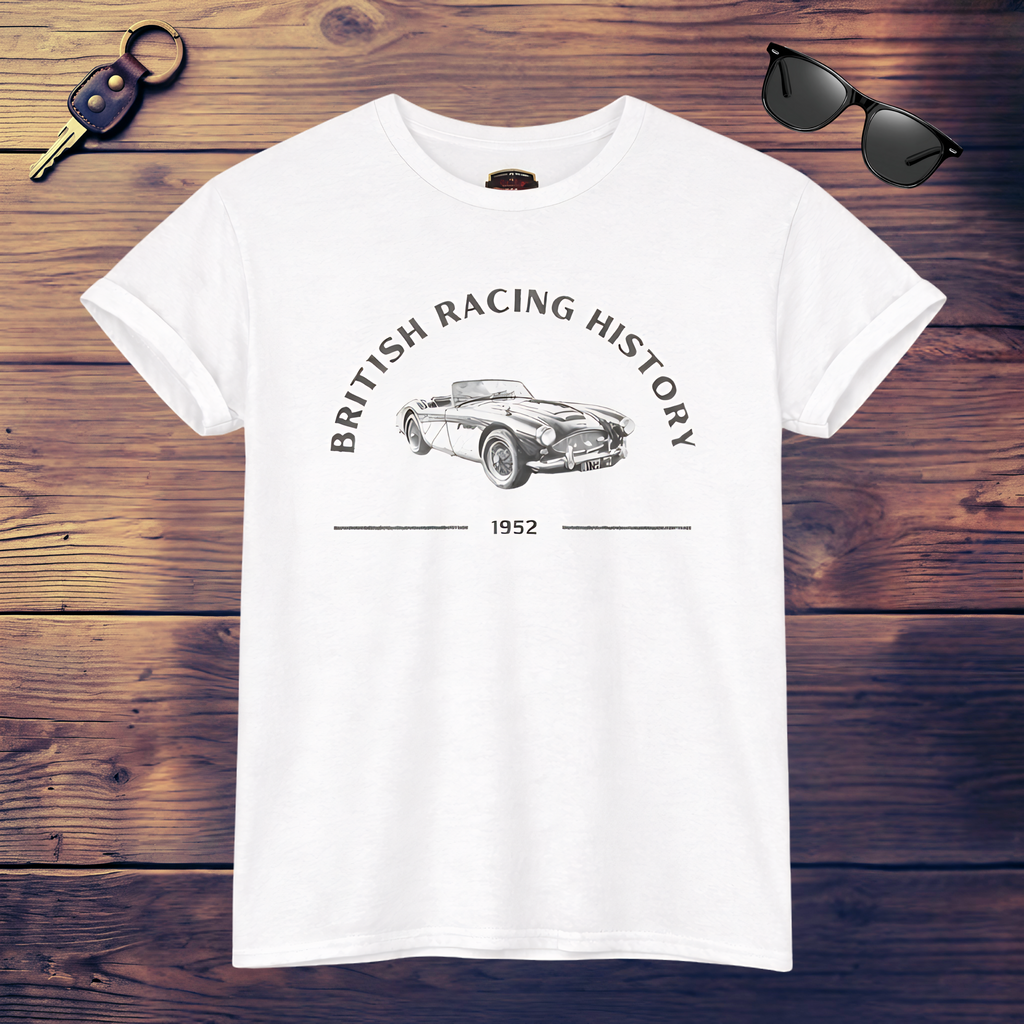 White t-shirt with British racing history design on a wooden surface with sunglasses and keychain.