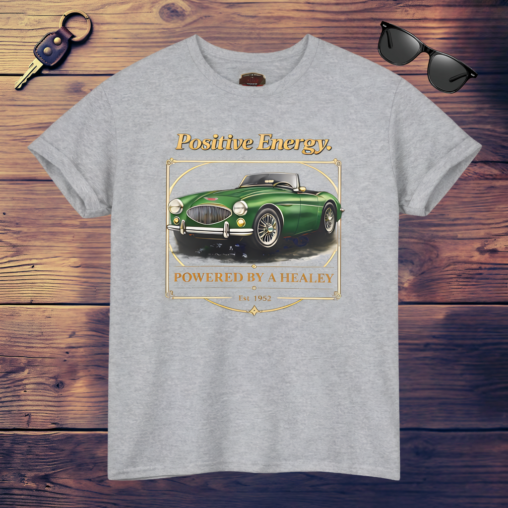 Sport gray t-shirt with a green Healey car graphic and 'Positive Energy' text on a wooden surface.