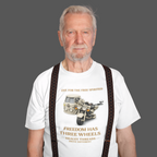 Man wearing a white t-shirt with a motorcycle graphic and text, standing against a plain background.