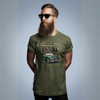 Man wearing a military green t-shirt with a classic car graphic design and text, standing against a plain background.
