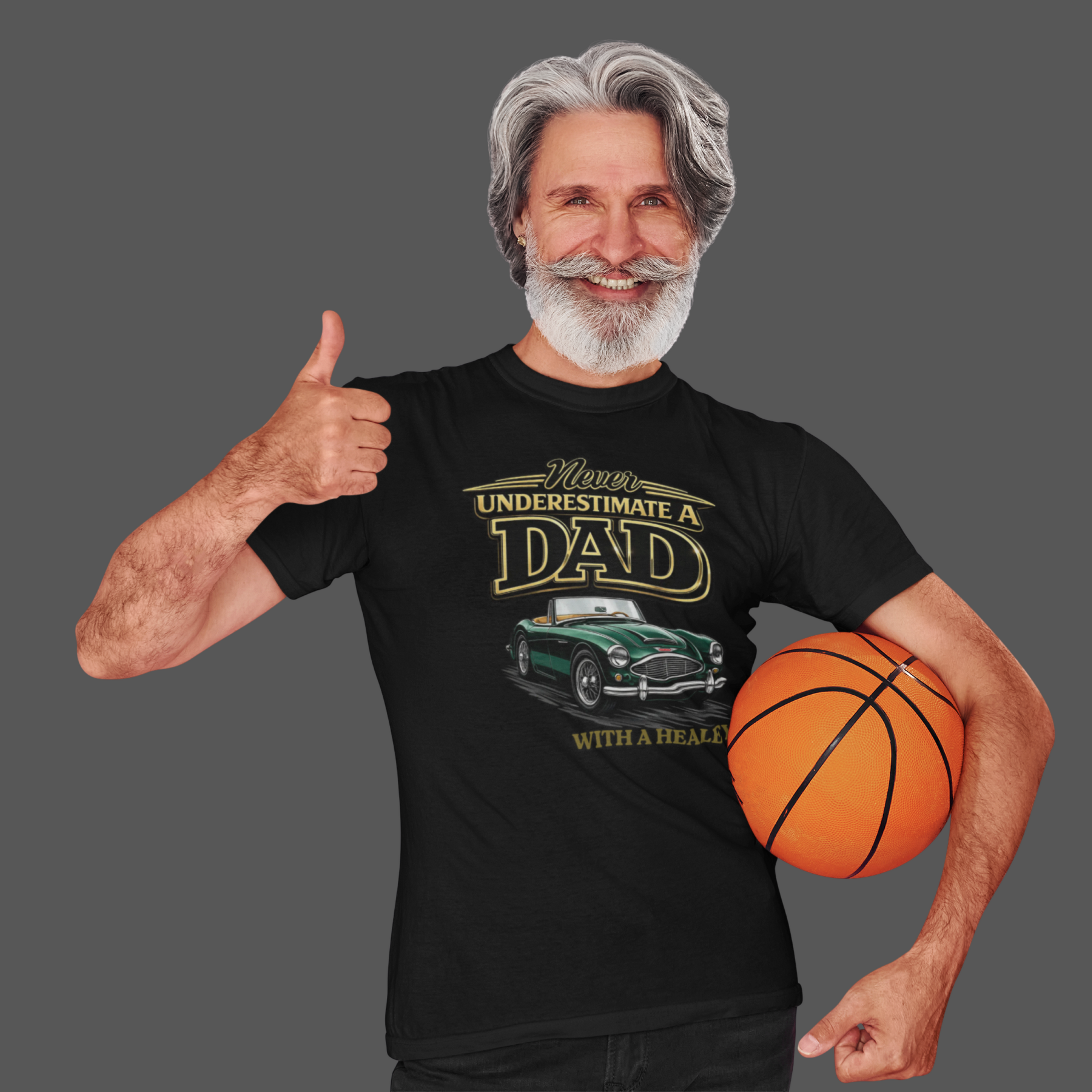 Man giving a thumbs up and holding a basketball, wearing a black t-shirt with a classic car graphic design.