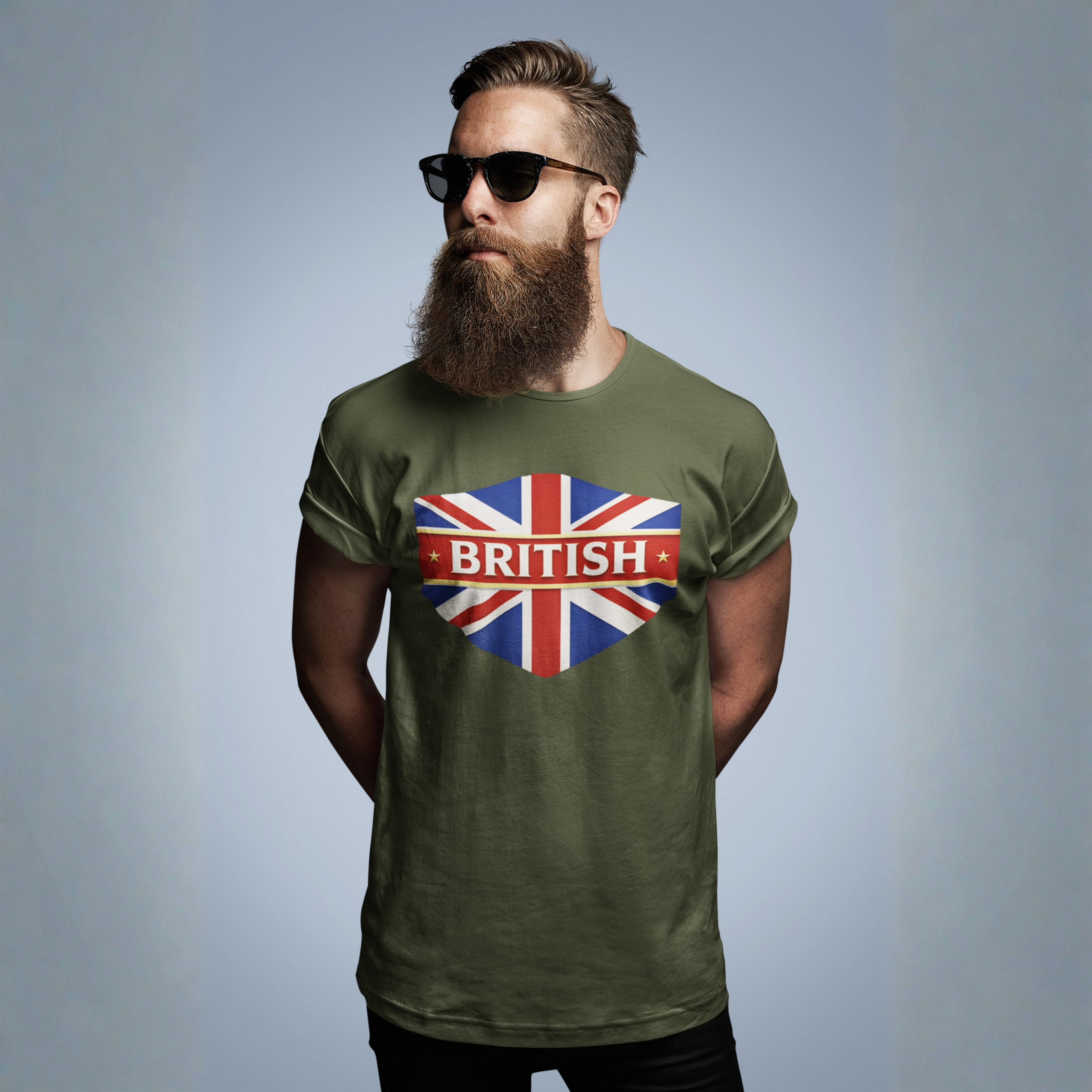 Man wearing a military green t-shirt with a British flag design on a gray background