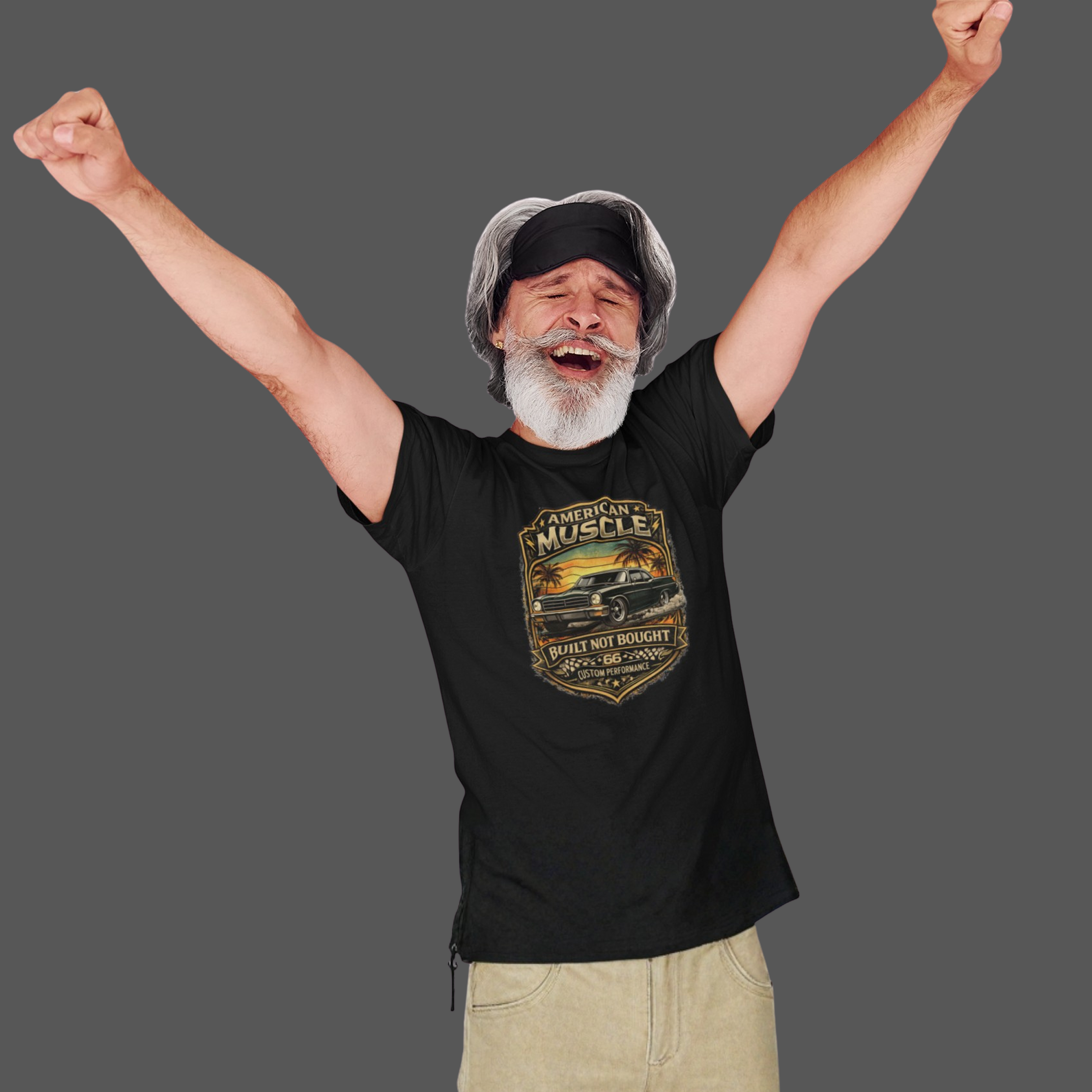 Man wearing a black t-shirt with a classic car graphic design, arms raised in excitement on a plain background