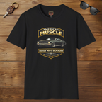 Black t-shirt with 'American Muscle' car graphic design on a wooden surface with sunglasses and keychain.